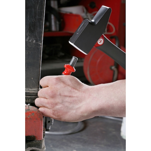 Facom 200C_50 hand tool in use for striking, close-up view, workshop setting.