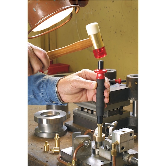 Facom 208A_25CBA punch tool used in workshop, black and red handle, hammer impacting top.