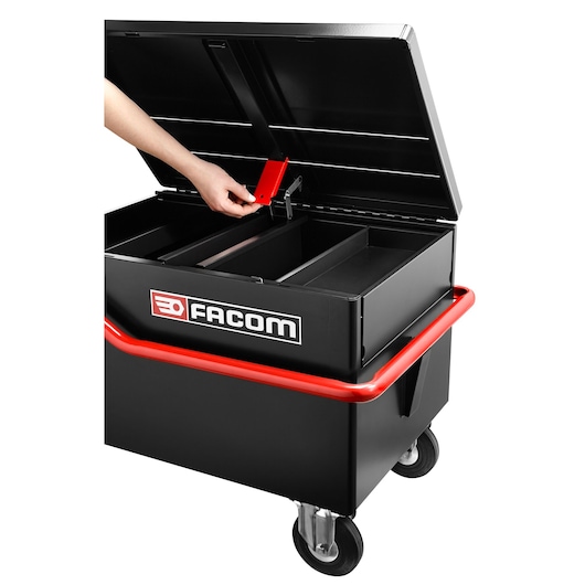 Facom 2092B rolling tool chest with open lid, black and red design, hand adjusting internal divider, front angle.