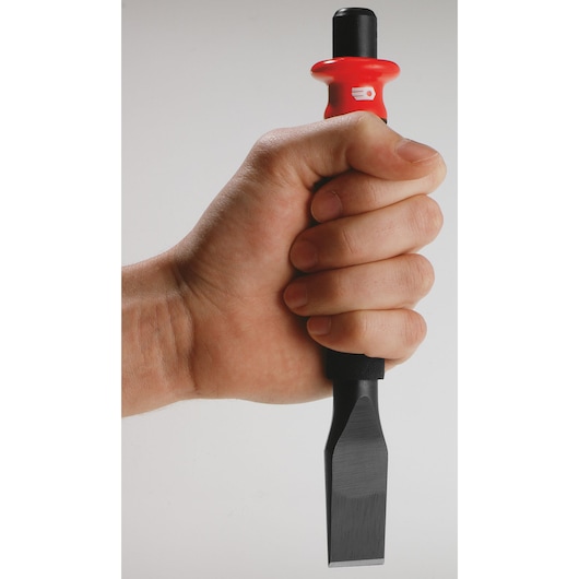 Photo of a Facom chisel with red and black handle, SKU 263_G19, held vertically in a hand, close-up view.