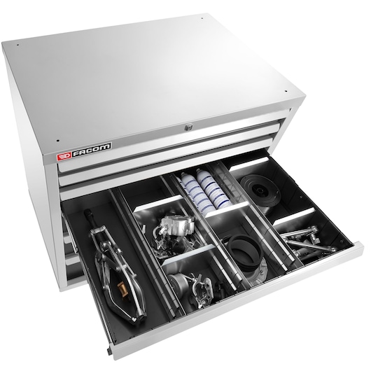 Facom 2930_C1 metal tool chest with open drawer, organized tools and accessories, top angle, white background.