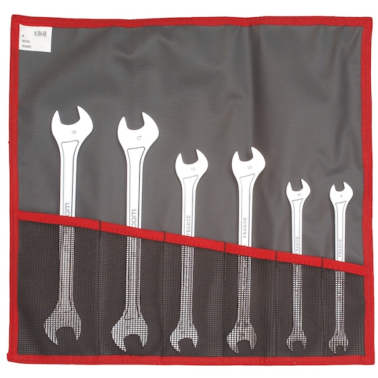 Facom 31_JE6T photography of open-end wrench set in a black and red tool roll, top-down angle.