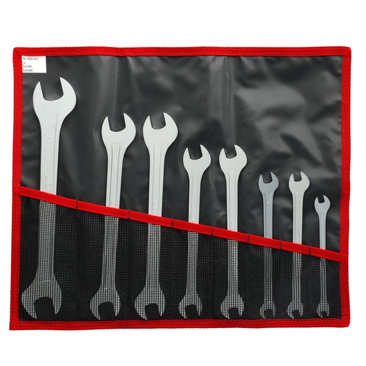 Facom wrench set SKU 31_JE8T, eight silver wrenches in black and red roll-up pouch, top view.