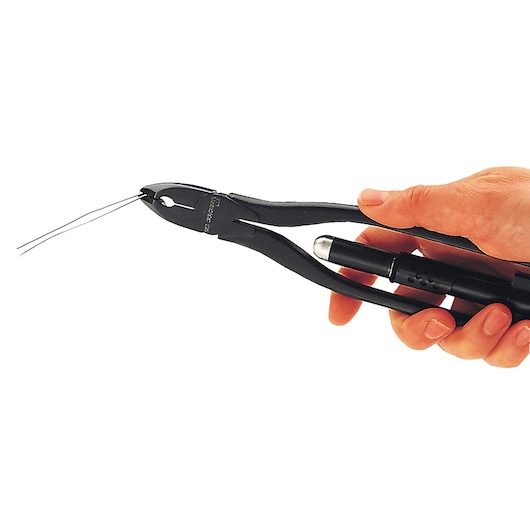 Photo of Facom 445_8R safety wire twisting pliers held in hand, twisting two metal wires.
