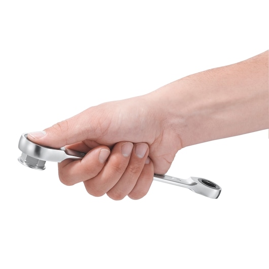 Facom 464J1 ratcheting wrench held in hand, side angle, chrome finish, on white background.