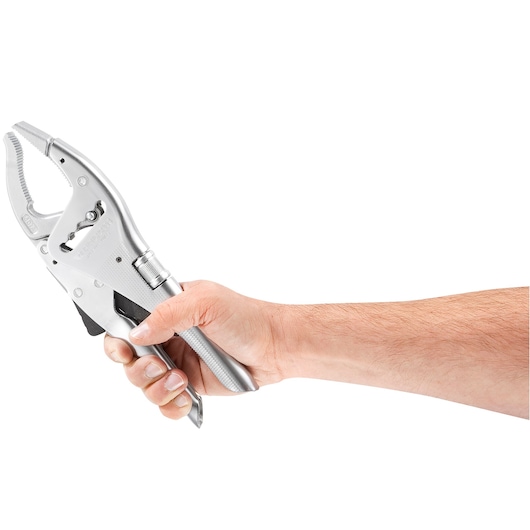 Photo of Facom 501A locking pliers held in a hand, side angle, metallic finish.