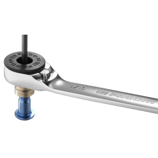 Facom ratcheting wrench 65PE, silver finish, angled view, with bolt and hex key.