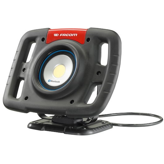 Facom 777_SPOTBT portable LED work light with Bluetooth, black and red, front angle on white background.