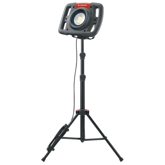 Facom 777_SPOTBT portable LED work light on tripod stand, front angle, black housing and red label.