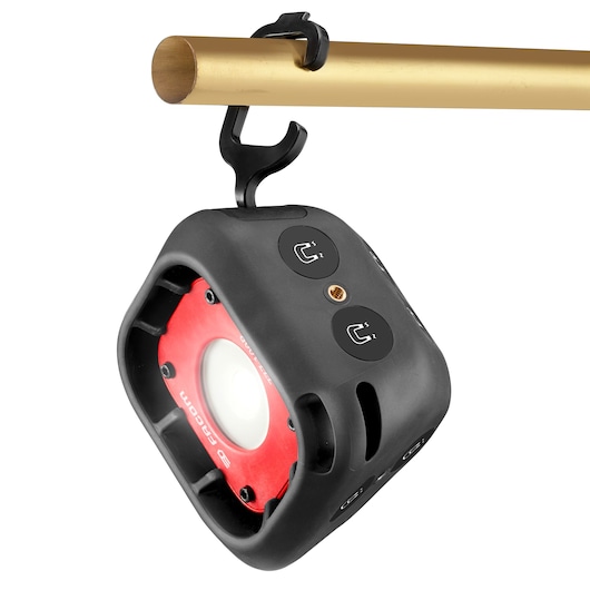 Facom 779.1000RPB compact LED work light in black and red, shown hanging from a metal bar, front angle.