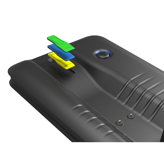 Facom 779.CL5PB tool tray detail with four colorful plastic clips in green, blue, and yellow on black surface, top angle.