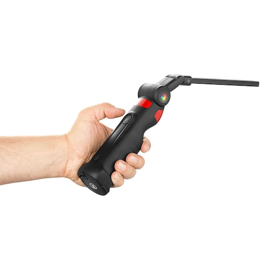 Photo of a Facom 779CML inspection lamp with black and red handle, shown in hand, side view on white background.
