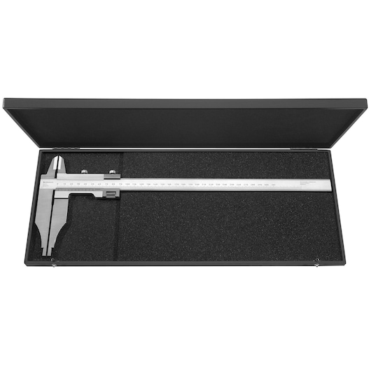 A metal vernier caliper placed inside a black protective case with foam padding. The case is open, showing the caliper and its ruler scale.