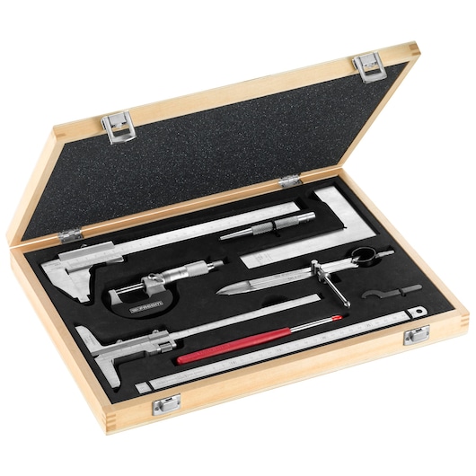 Facom 809J2 precision measuring tool set in wooden case, top view, including caliper, micrometer, ruler, and gauge.