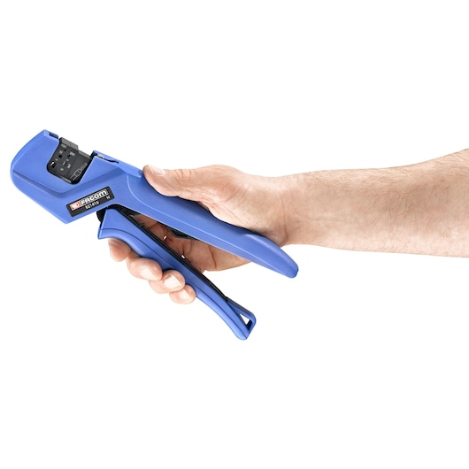 Photo of Facom 821416 blue cable crimping tool held in a right hand, side angle on white background.