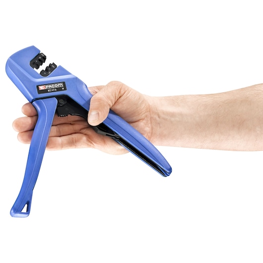 Photo of a blue Facom 821416 wire stripper tool in a hand, side view on white background.