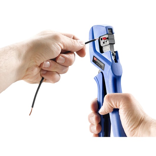 Photo of Facom 821416 wire stripper in blue used to strip black electrical wire.