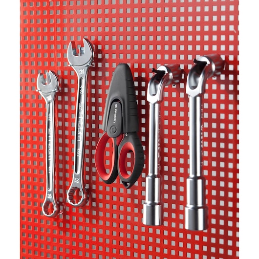 Facom 841A.3PB hand tools, including wrenches and scissors, organized on a red perforated panel, side view.