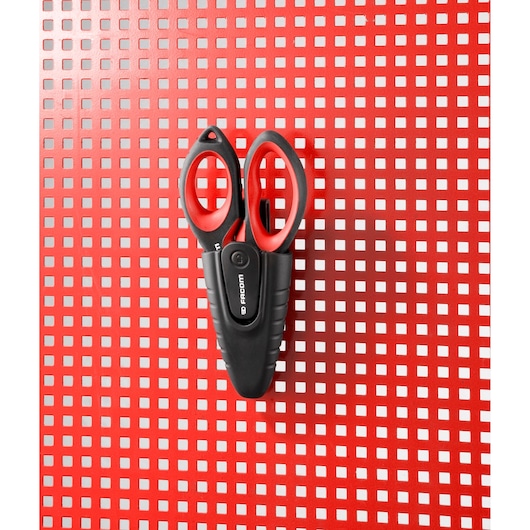Facom 841A.3PB black and red scissors in plastic holder on red perforated board, front view.