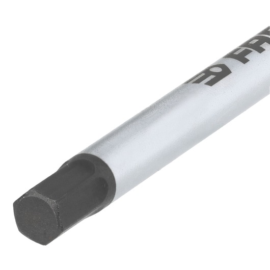 Close-up of a Facom hexagonal socket bit with a black tip and a metallic shaft, suitable for use with compatible hand tools.