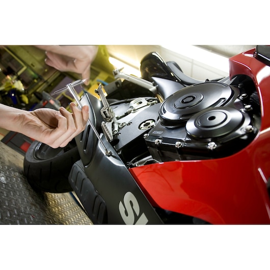 Photo of Facom 84TCD_2_5 hex key being used to repair a motorcycle engine.