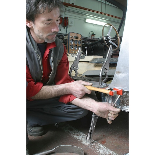 Facom 862D_60 hand tool with red head used for metalwork in automotive repair workshop.
