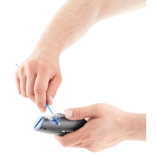 Photo of Facom 872271 wire stripper tool in use, stripping blue wire, close-up on hands, white background.