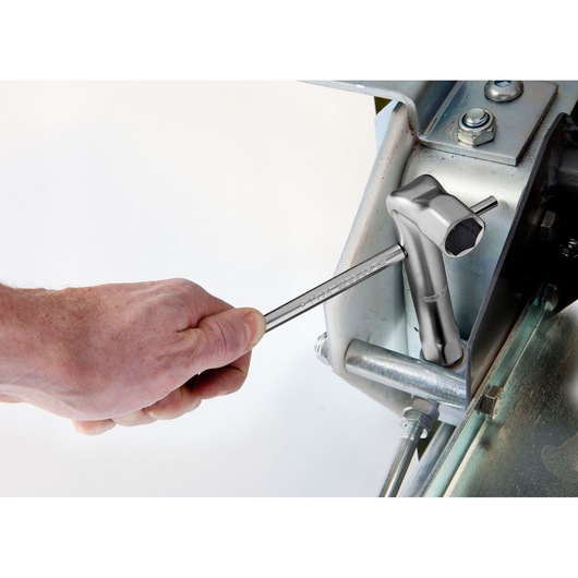 Facom 92A_17 T-handle socket wrench in use tightening a bolt on metal machinery.