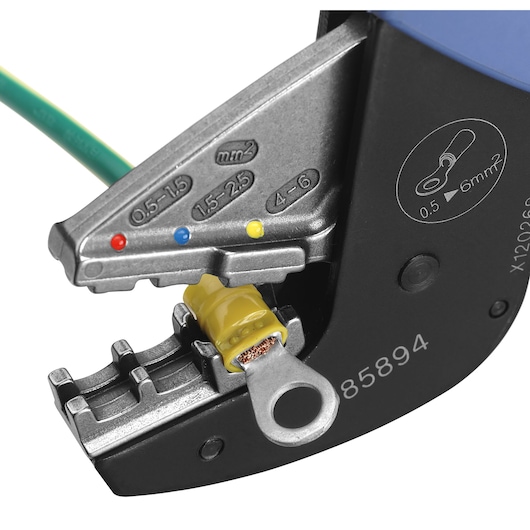 Facom 985894 crimping tool close-up with wire terminal, silver metal jaws, colored size markers, white background.