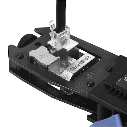 Facom 985902 network cable crimping tool close-up with RJ45 connector, white background.