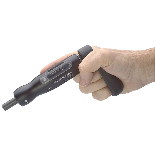 Photo of Facom A_300PA torque screwdriver in hand, black body with visible torque scale, side angle.