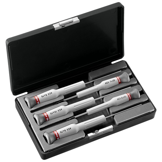 Facom AEX_J1 precision screwdriver set in black case, five grey screwdrivers with red accents, top view.