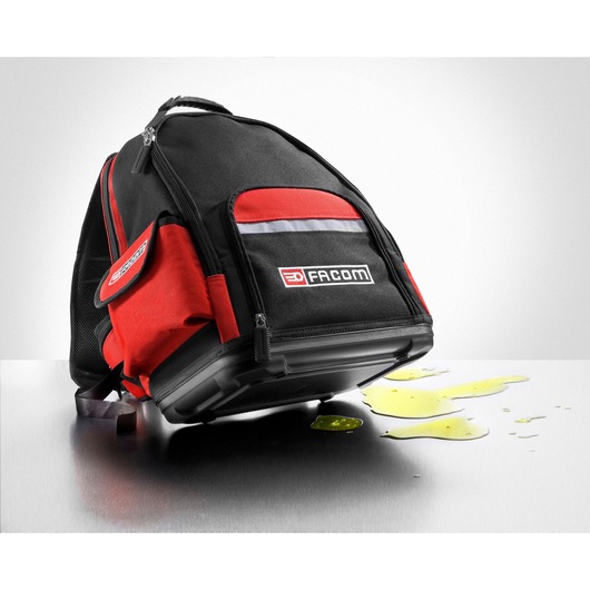 Facom BS.L30PB black and red backpack photography with liquid spilled on metal surface, side angle.