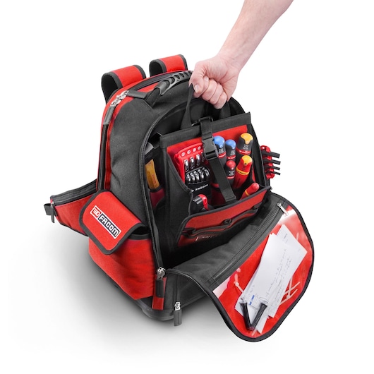 Facom BS.L30PB tool backpack in black and red, open to show organized tools and documents, front angle.