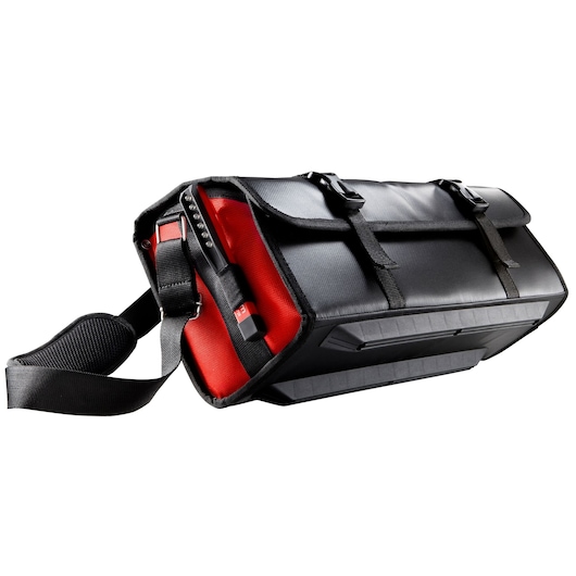 Facom BS.LMBCPB tool bag with black and red design, adjustable shoulder strap, and protective bottom, angled view.