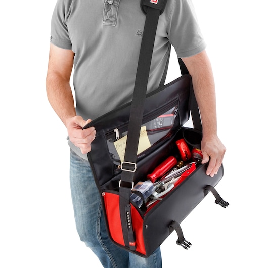 Facom BS.LMBCPB photography of tool bag with red and black accents carried over shoulder, filled with tools.