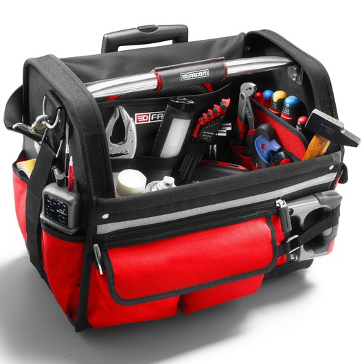 Facom BS.R20PB open red and black tool bag filled with various hand tools, photographed at front angle on white background.