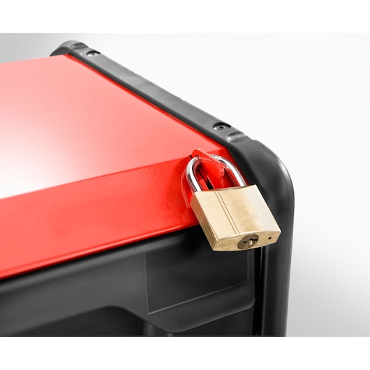 Facom BT203 toolbox corner with a brass padlock securing the red lid, close-up on white background.