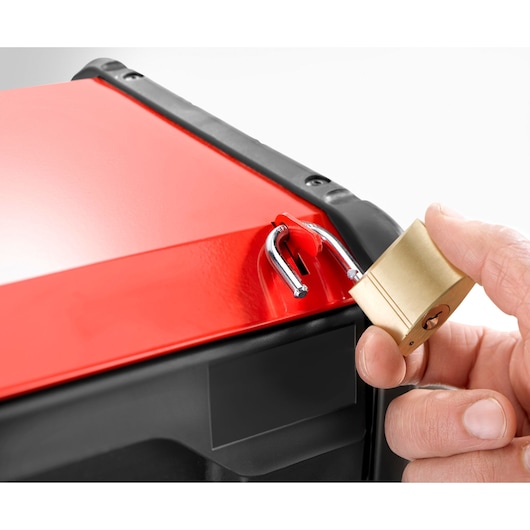 Facom BT203 toolbox close-up, red lid being locked with a brass padlock, front angle.