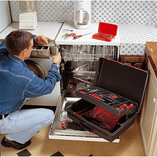 Facom tool case BV_21ST with organized hand tools, open in kitchen, used for appliance repair.