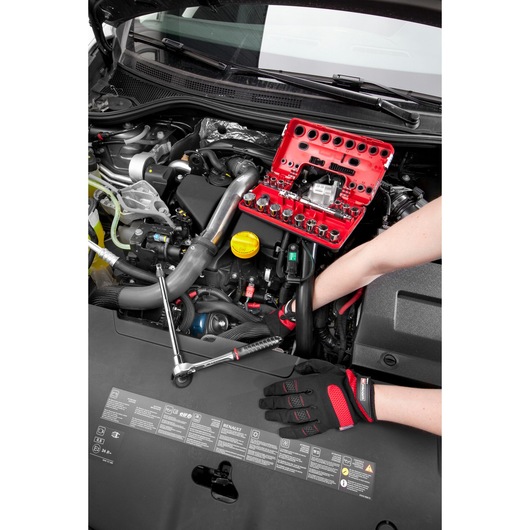 Facom C48-2 socket set in red case used on car engine, mechanic wearing gloves, photography close-up.