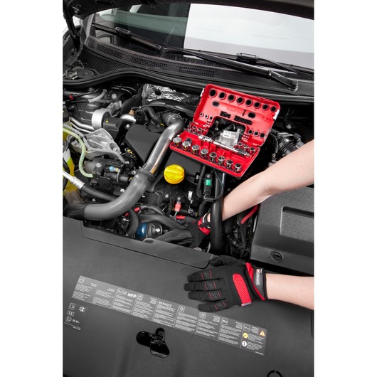 Facom C48-2 socket and tool set in red case used on car engine by gloved hands.