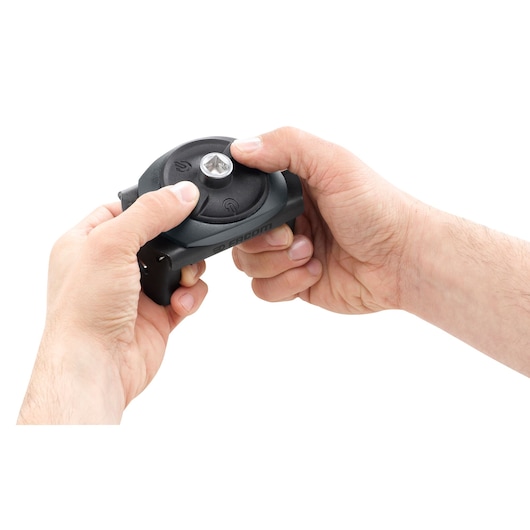 Photo of Facom C.48-J2PB ratchet wrench being held in two hands, close-up on white background.