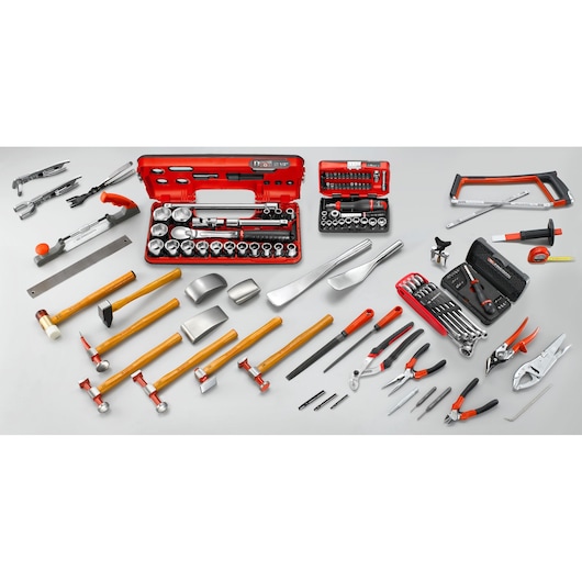 Facom CRCM92 hand tool set with red cases, assorted hammers, pliers, sockets, wrenches, and saws displayed on a white background.