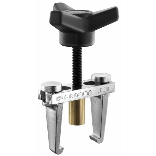 Facom CR_D10 bearing puller, silver metal with black handle and brass center, studio angle.