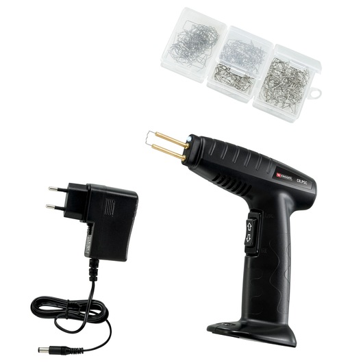 Facom CRPSC plastic welding kit with black welding tool, charger, and three boxes of metal staples, side view.