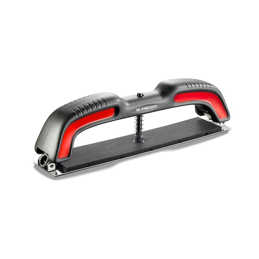 Facom CRSBL manual sanding block in black and red, angled view, ergonomic handle, photography.