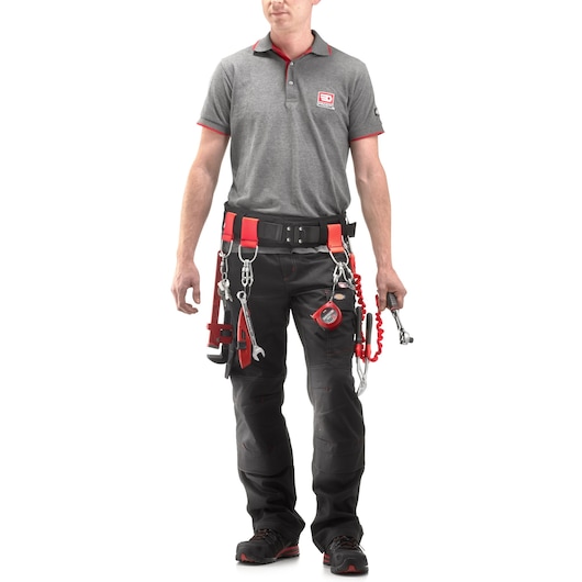 Facom CT70-100 tool belt set worn by a technician, includes safety clips, wrenches, and measuring tape, front view.