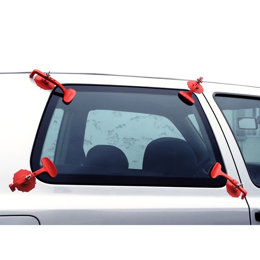 Facom DCR20J6 red suction clamps attached to a car window, exterior side view.