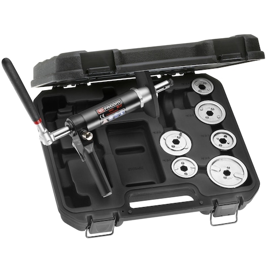 Facom DF17-100 flaring tool kit with black handle and multiple metal dies in hard plastic carrying case, top view.
